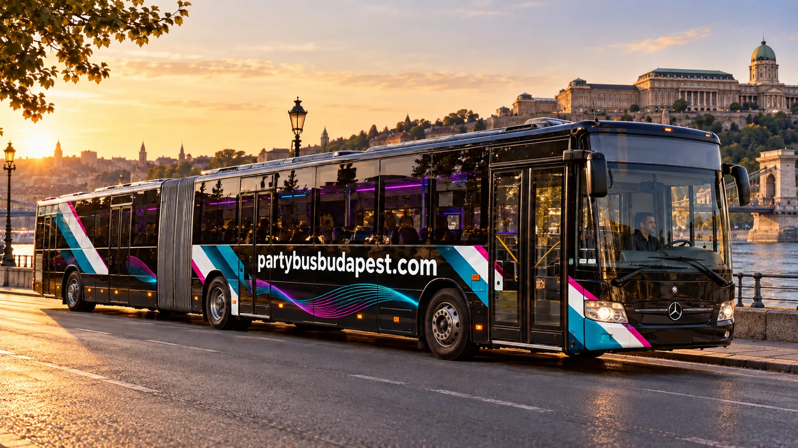 Black articulated Mercedes party bus beside the Danube in Budapest